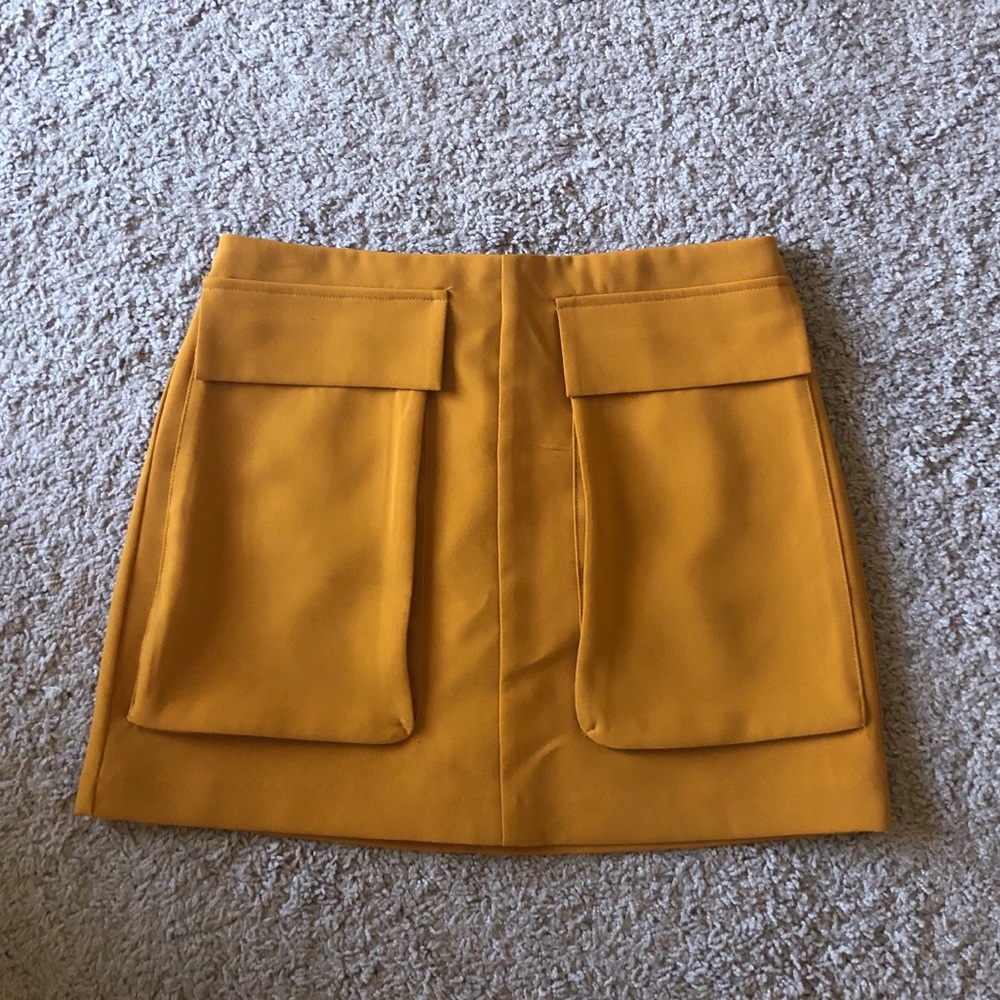 yellow/orange mini skirt